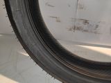 a close up of a tire tire on a white surface
