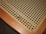 a close up of a table with a chair and a table cloth
