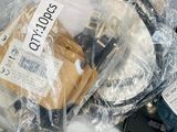 a pile of electronic equipment that is wrapped in plastic