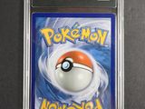 a close up of a pokemon card in a plastic case