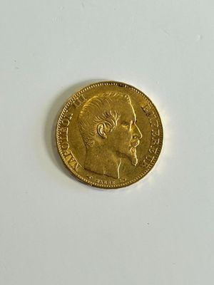 an image of a gold coin sitting on top of a white surface