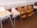 a row of chairs and a table in a room