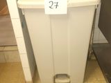 a trash can with a price tag on it in a public restroom