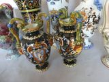 a lot of vases that are sitting on a table