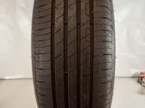 a close up of a tire on a white surface