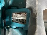 a cordless drill that is attached to the handle of a cordless drill