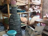 a room filled with lots of boxes and boxes of clothes