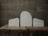 three white blocks sitting on top of a wooden table