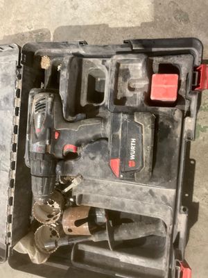 a tool box with tools inside of it on the floor