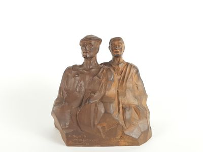 statue of a man and woman sitting on a rock with a white background