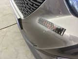 a close up of a car ' s grille with the word occupy on it
