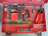 a red tool box with tools in it on a table