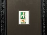 a black frame with a picture of a woman in a green dress