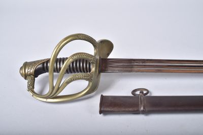 an old sword with a brass handle and a wooden sheath