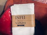 a bag of clothes sitting in a box with a label on it