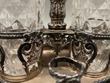 a silver tray with two glasses and a ring on top of it