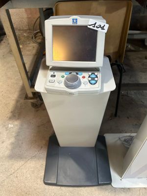 an image of a small machine with a monitor on top of it