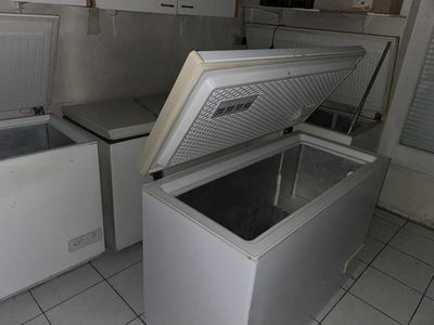 a white chest freezer sitting inside of a kitchen