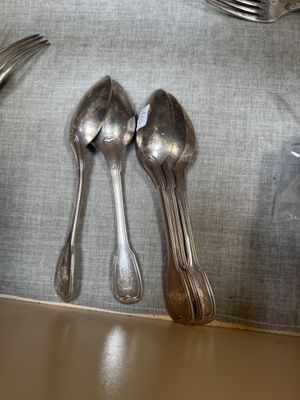 silver spoons, forks and spoons on a table