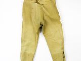 a close up of a pair of yellow pants on a white surface