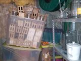 a room with a lot of clutter and items on the shelves