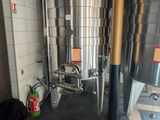 an image of a large stainless steel tank in a room
