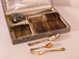a box with silverware in it on a table