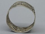 an old silver ring with a design on the inside