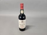 a bottle of wine that is sitting on a table