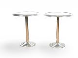 pair of round side tables with metal bases
