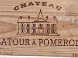 a wooden sign that says chateau latour a pomerol