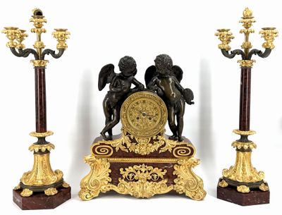 three statues of cherenshes and a clock on a stand