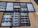 many pairs of glasses in a case on the table