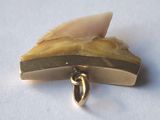 a picture of a piece of jewelry on a white surface