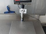 an image of a scale on a table in a kitchen
