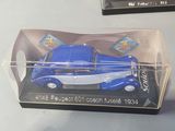 two toy cars in a clear box on a table