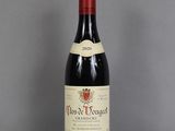 a bottle of wine that is sitting on a table