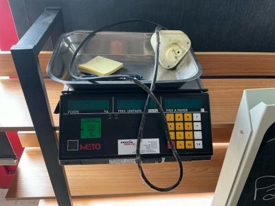 a scale with a piece of butter on top of it