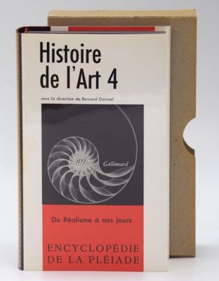 an open book sitting on top of a cardboard box next to a pair of scissors