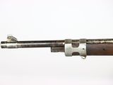 an old rifle with a wooden barrel and metal fittings on a white background