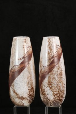 two wine glasses that are sitting on a table