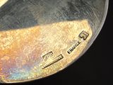 a close up of a metal spoon with a handle