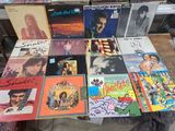 a lot of records on a table in a room