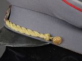 uniform of a soldier ' s cap with a red line on the side