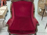a red chair that is sitting in a room