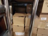 a stack of boxes sitting on the floor next to a table