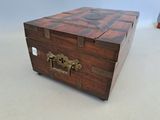 a small wooden box that has a handle on it