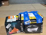 two boxes of food sitting on the floor next to a box of food