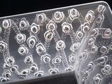 a clear plastic container with a bunch of flowers inside of it