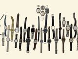 many different types of watches displayed on the wall